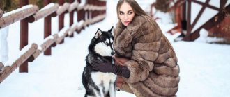 girl in a fur coat with a dog